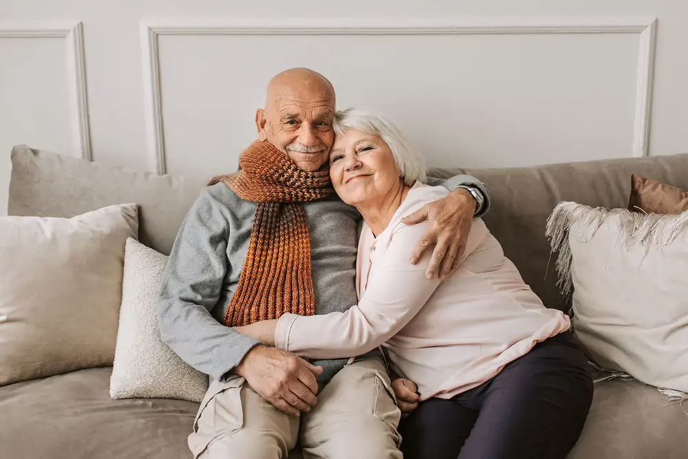 A caregiver sharing a warm moment with a senior at home in the Coachella Valley